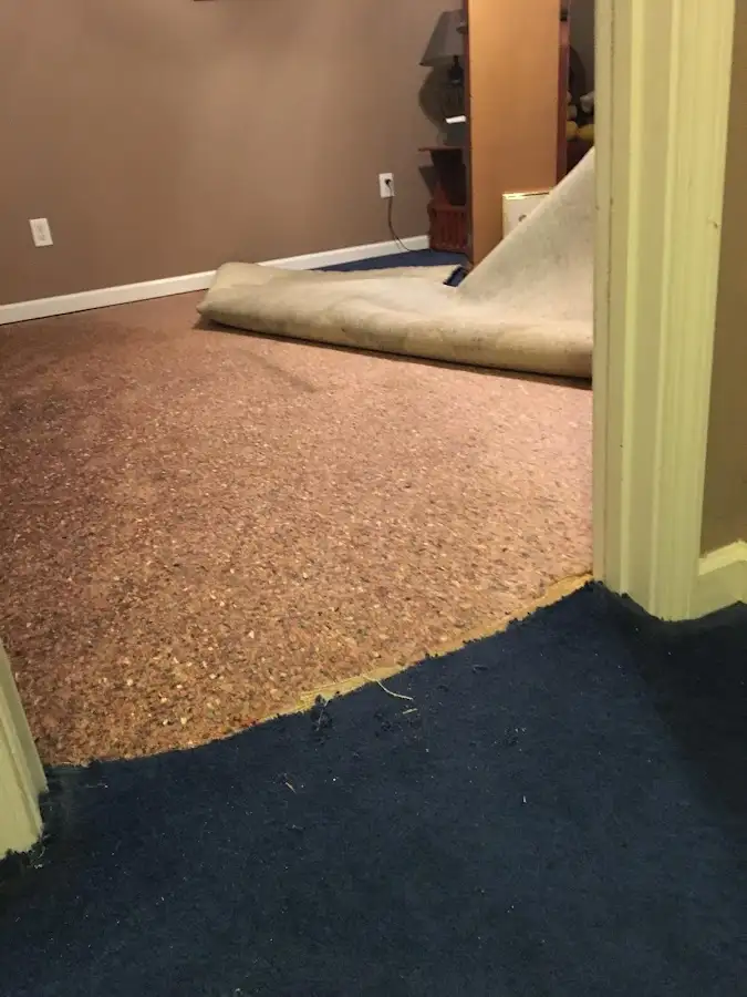 Carpet pad removal revealing water damage during Drying & Dehumidification in Wailuku